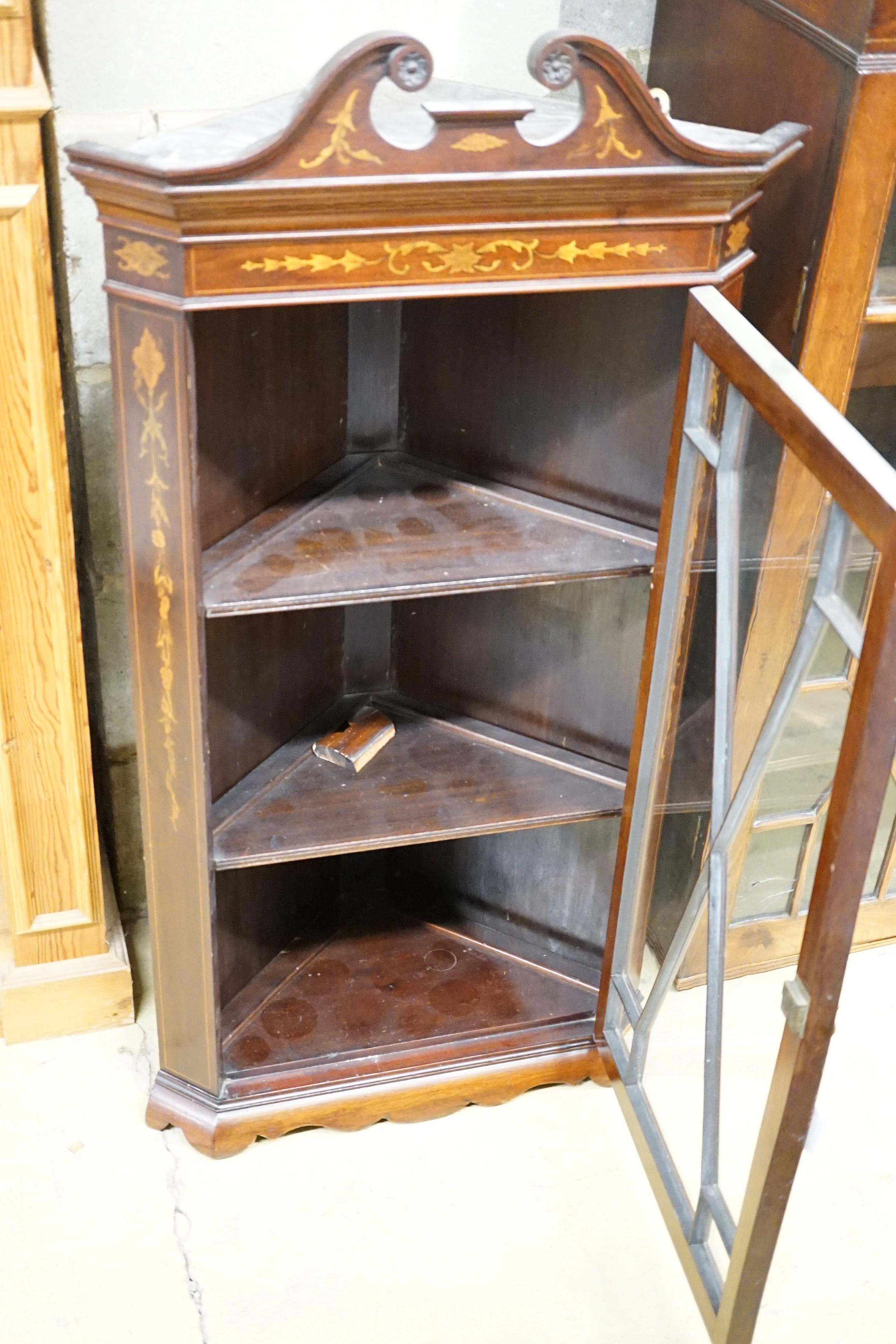 An Edwardian inlaid mahogany hanging corner cabinet, width 58cm, height 107cm